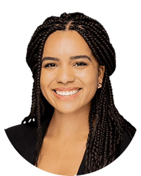 A smiling woman with braided hair.