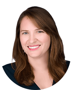 A portrait of a woman with brown hair.