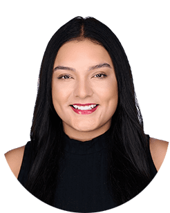 A woman with long hair smiling in a black top.