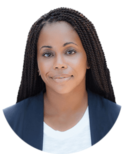 A black woman with dreadlocks in a white shirt.