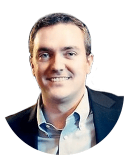 An image of a man smiling in a business suit.