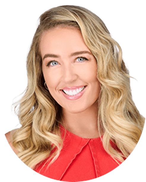 A smiling woman with a red top.