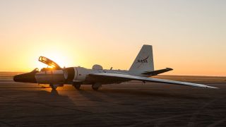 a white jet on a tarmac