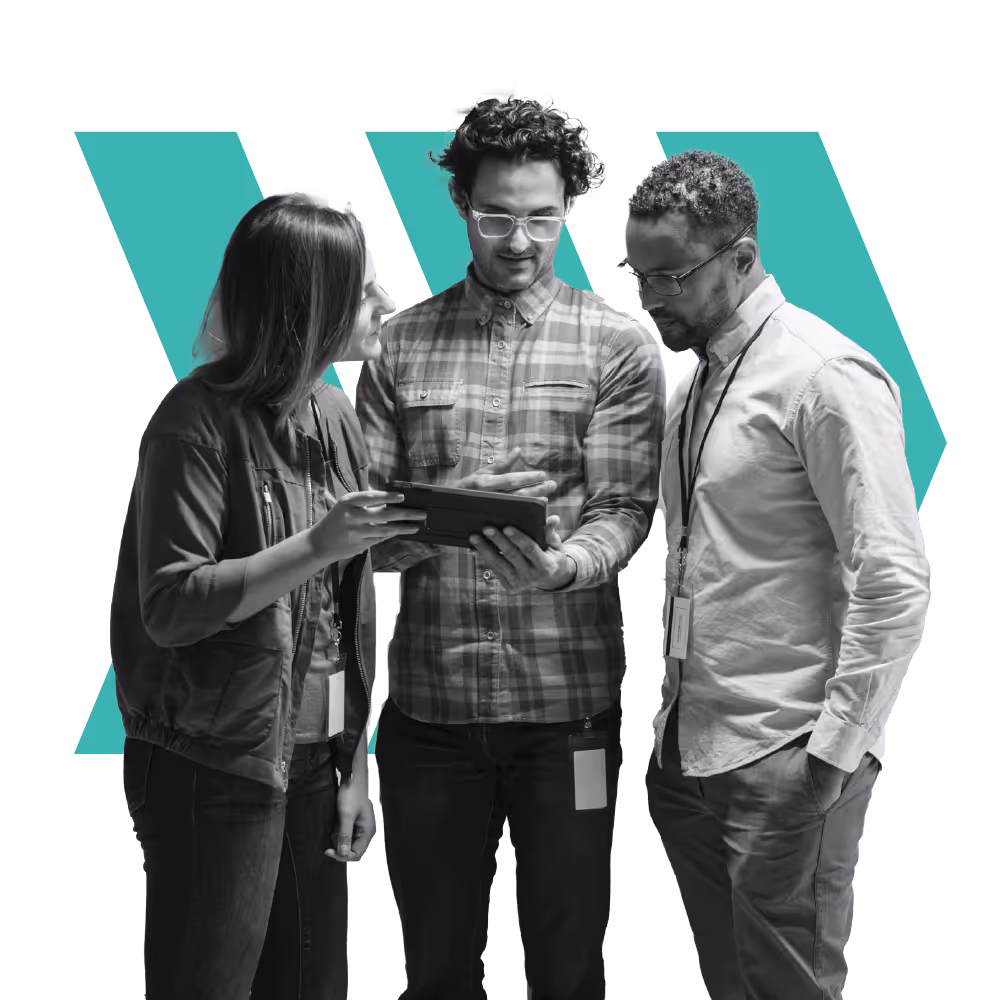 Three professionals looking at a tablet together, with a teal stylized W shape in the background.