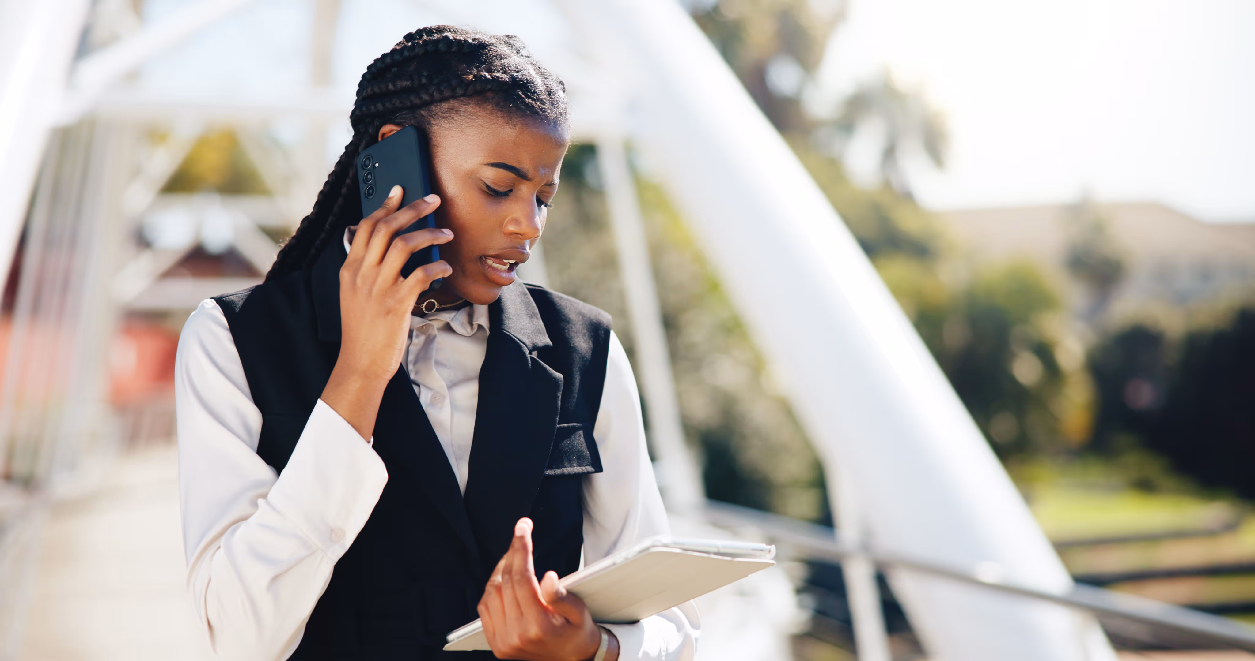 event planner talking on phone and looking at documents