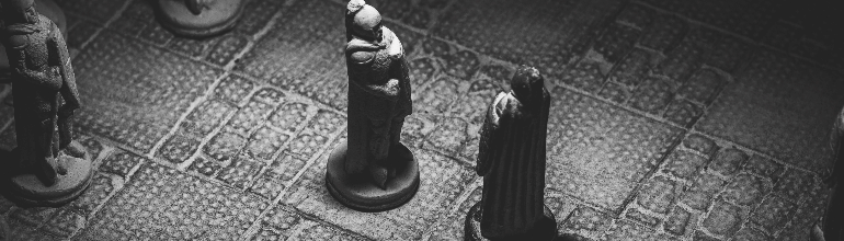 A black and white portrait of two soldier pieces