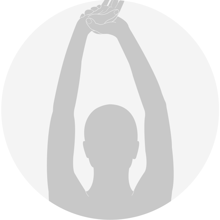 Person stretching arms overhead as an ergonomic break.