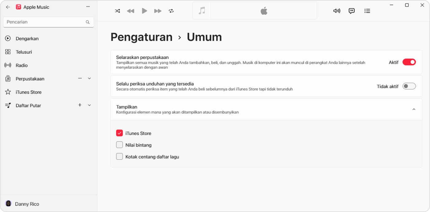 App Apple Music untuk Windows menampilkan Selaraskan Perpustakaan yang dinyalakan di Pengaturan > Umum.