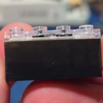 LEGO SMART brick from its side. (Credit: EvilmonkeyzDesignz, YouTube)
