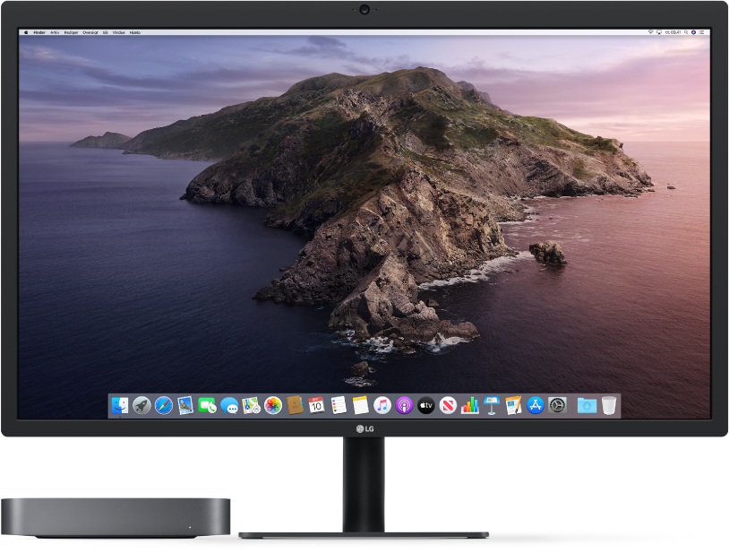 Mac mini ved siden af en skærm.