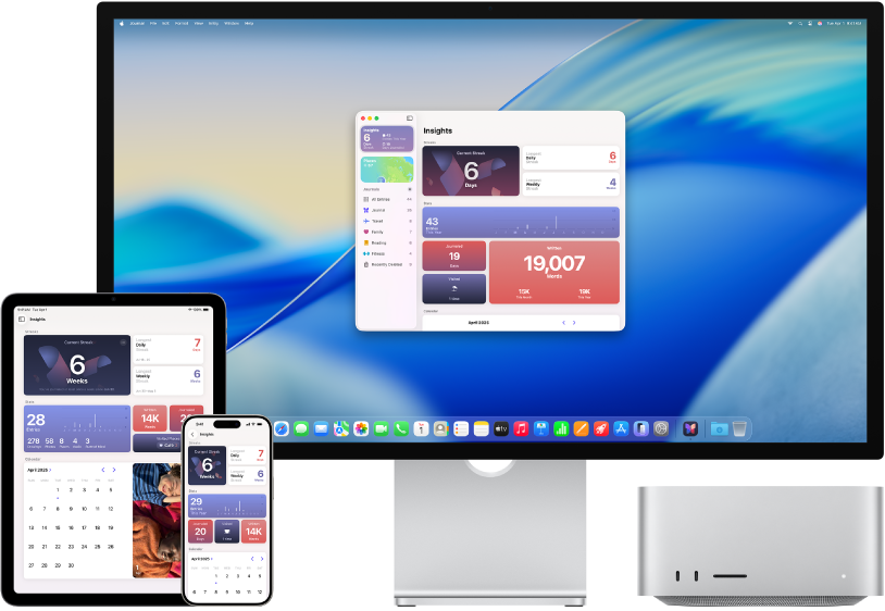 Mac Studio neben verschiedenen Zubehörgeräten, die alle auf dieselben iCloud-Inhalte zugreifen