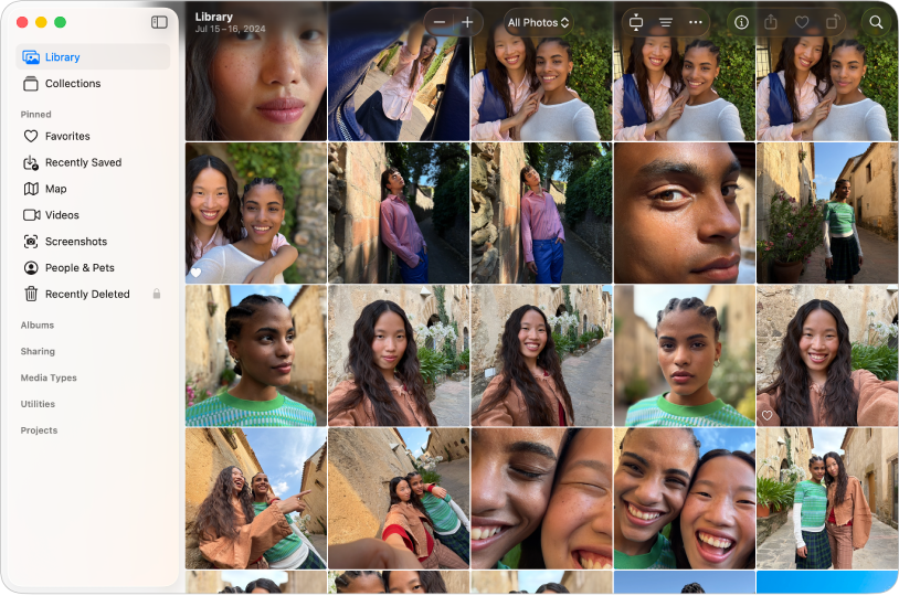 Das Fotos-Hauptfenster zeigt, dass „Mediathek“ links in der Seitenleiste ausgewählt ist. Die Fotos sind auf der rechten Seite in einem Raster sortiert und oben befindet sich die Symbolleiste.