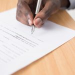 hand with pen and paper
