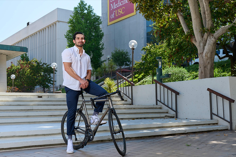 USC Student on bicycle at USC Health Sciences campus
