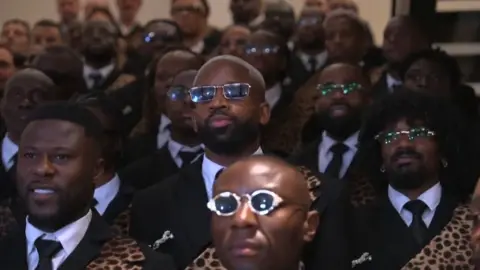 A group of players of the Democratic Republic of Congo display their outfits designed by Alvin Junior Mak