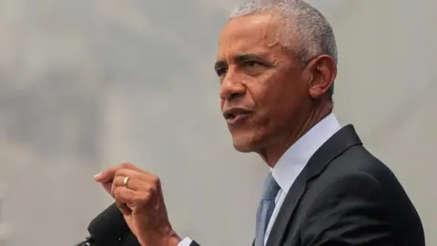 Obama speaks at a podium