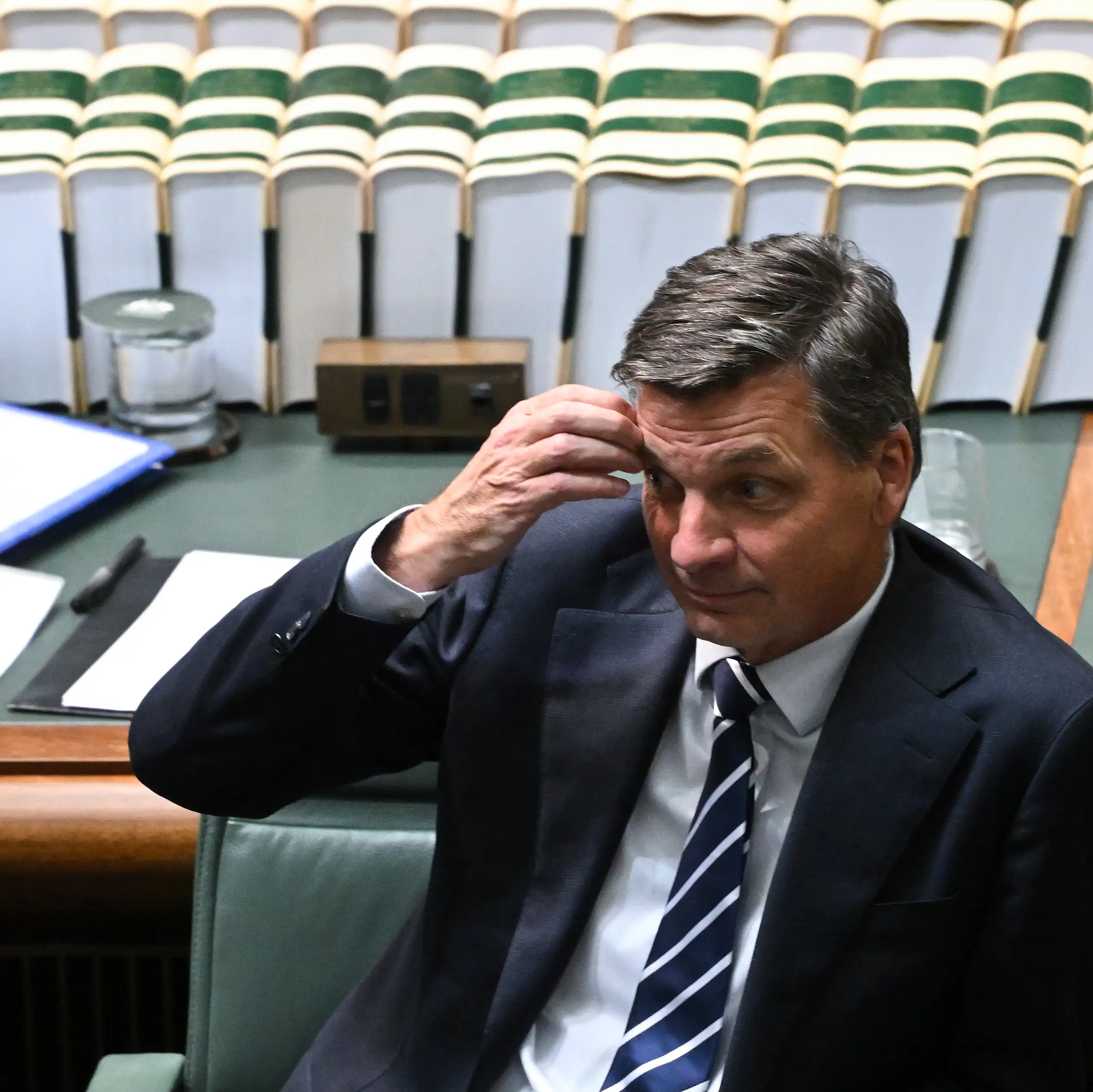 Angus Taylor scratching his forehead in parliament