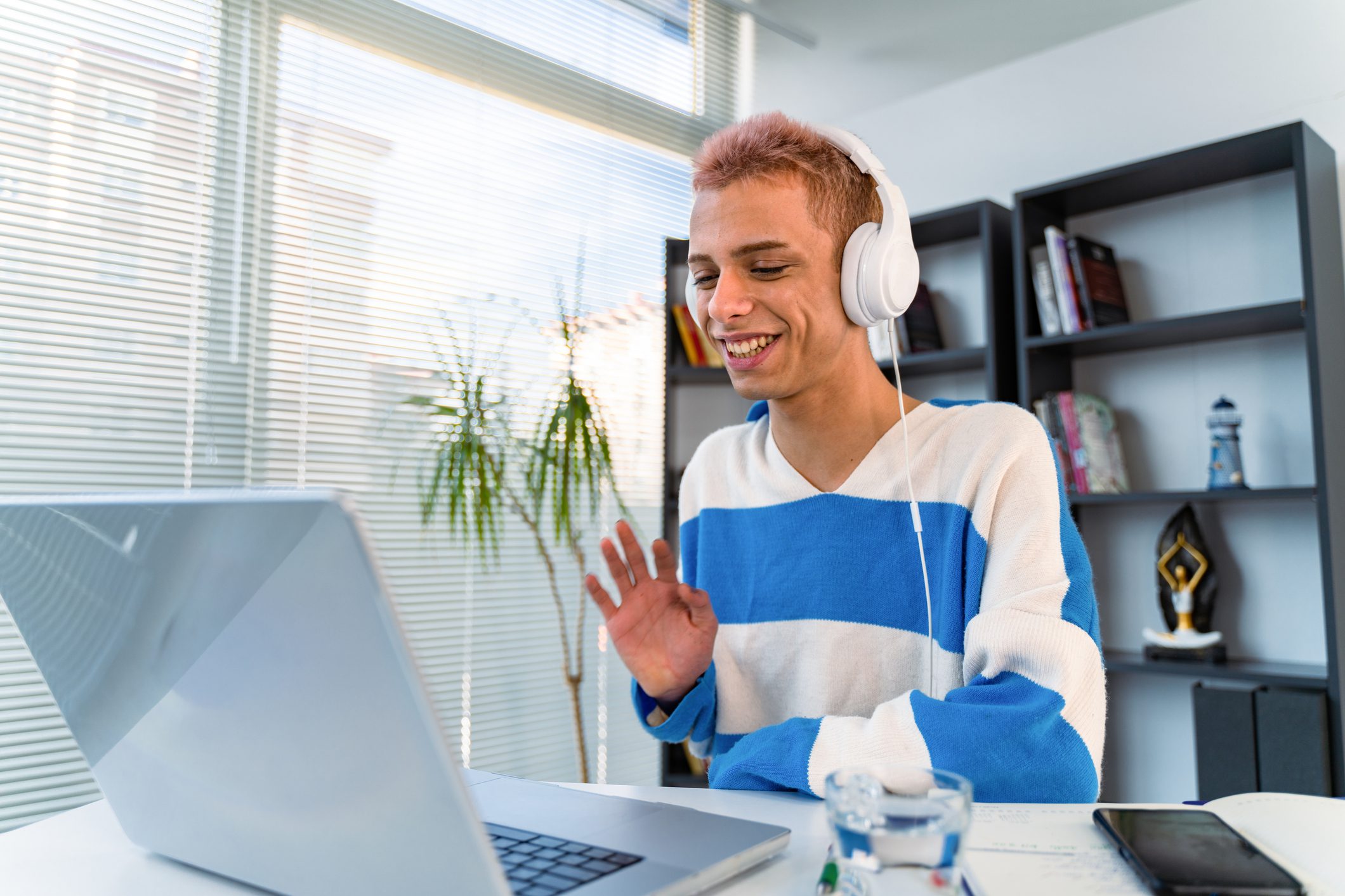 Transgender person using laptop working from home