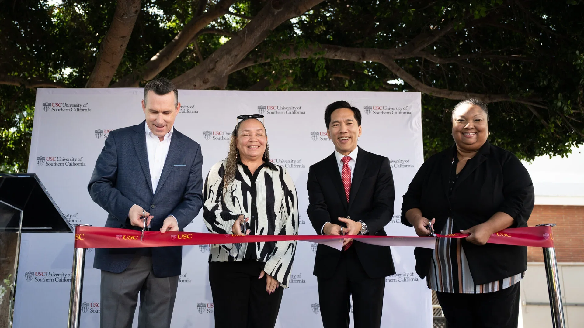 Samuel Garrison, Tosha Bunn-Bell, USC President Beong-Soo Kim and April Smith cut the ribbon at Thursday’s Early Head Start and Head Start Center opening. (USC Photo/Kristopher Head)
