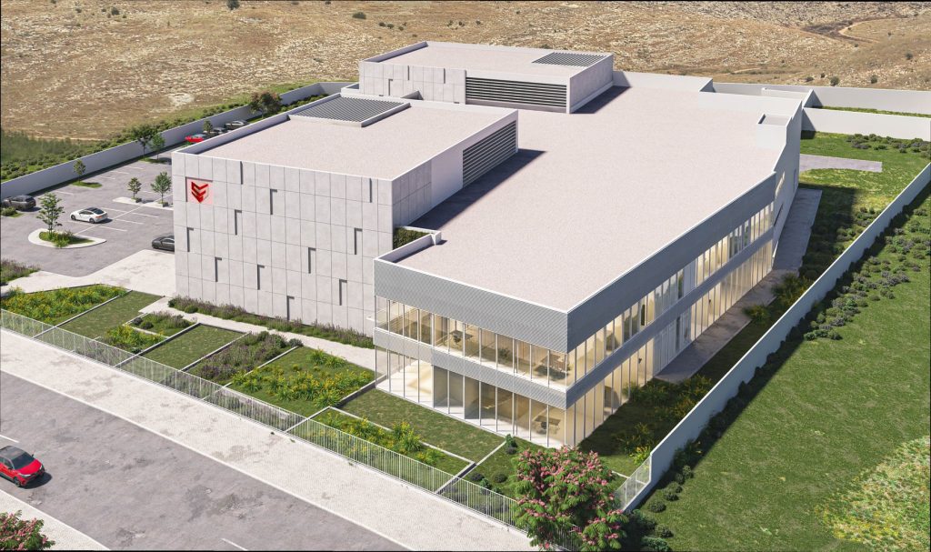 Modern architectural design featuring a spacious, multi-level building surrounded by landscaping and parking areas.